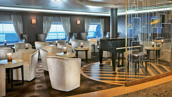 The Navigator Lounge got new furniture to provide more space for coffee and cocktails around the piano. The Navigator Lounge got new furniture to provide more space for coffee and cocktails around the piano.