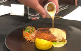 After the dome is cleared, the salmon is finished with a tamarind-whiskey sauce.