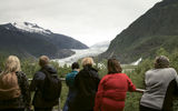 Queen Elizabeth passengers gaze at the Mendenhall Glacier from the glacier's visitor center in Tongass National Forest, Juneau.