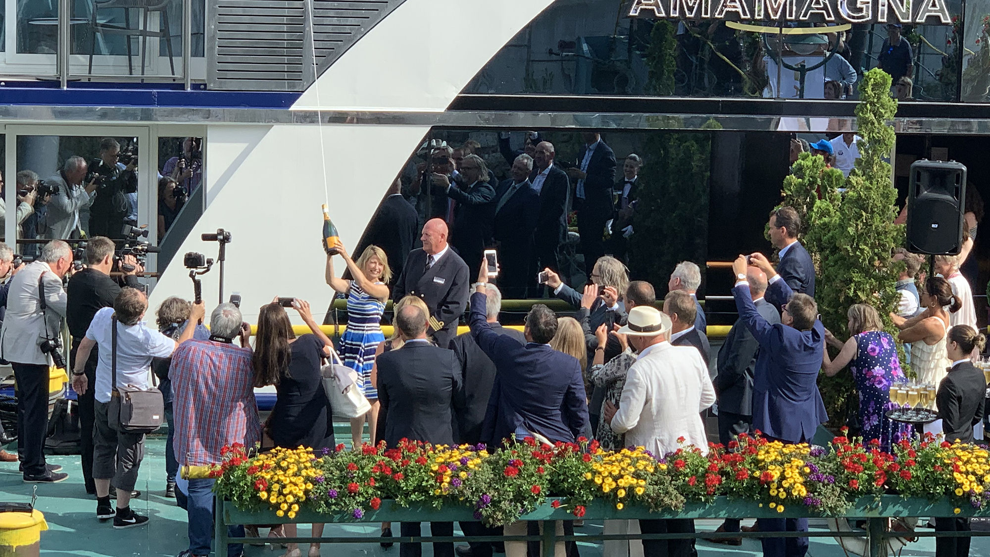 Travel television host Samantha Brown takes a second swing to officially christen the AmaMagna.