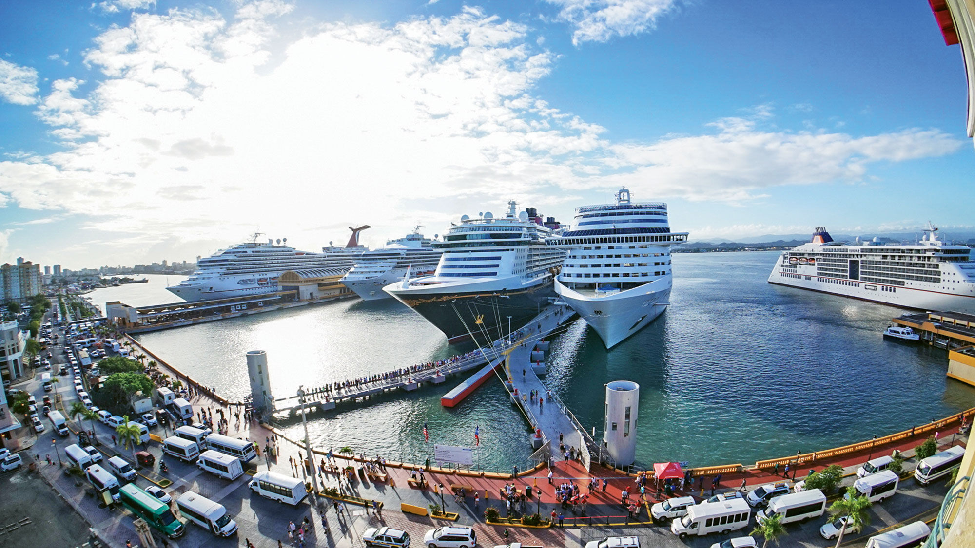 A file photo shows multiple cruise ships docked in San Juan.