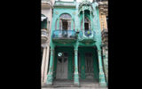 Classic buildings, many in states of disrepair, line the streets of Havana.