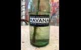 The slogan on this bottle on a restaurant table is a takeoff on the slogan for Las Vegas (What happens in Vegas stays in Vegas).