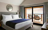 A room in a beachfront cottage at Gurney's Montauk Resort & Seawater Spa, a 146-room property on 2,000 square feet of private beach.