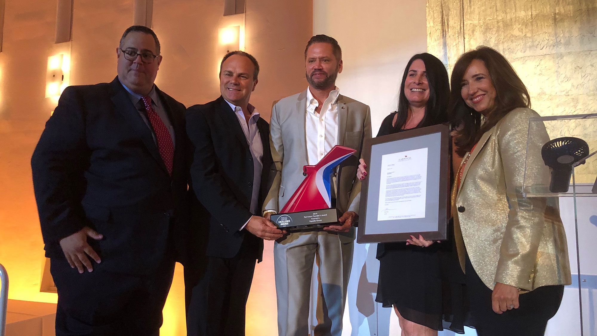 The Ted Arison Founders Award was presented to Expedia Group. From left, CLIA's Charlie Sylvia, Expedia Group's Matthew Eichhorst, Carnival Cruise Line's Adolfo Perez, Expedia's Koreen McNutt and Carnival president Christine Duffy.