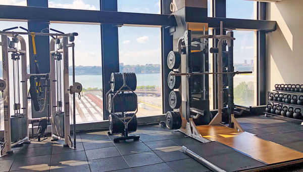 Exercise equipment and views of the Hudson River at the hotel's expansive Equinox Fitness Club. Exercise equipment and views of the Hudson River at the hotel's expansive Equinox Fitness Club.