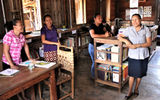 The village library, funded by proceeds from the nonprofit Caiman House, is attached to the front of the lodge.