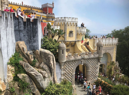 The 19th century Pena Palace, built around the remains of a hilltop monastery, is one of the prime tourist draws in Sintra, once the summer retreat of Portuguese royalty. The 19th century Pena Palace, built around the remains of a hilltop monastery, is one of the prime tourist draws in Sintra, once the summer retreat of Portuguese royalty.