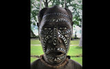 This carved, inlay head in the dining room is typical of designs found in Guadalcanal's eastern area around the Marau Sound.