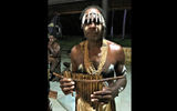 The resort's security guard is also the leader of a local panpipe band, and his group performs for guests.