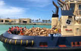 The cruise line launched an ambitious hurricane relief program to provide tens of thousands of meals daily to victims of Hurricane Dorian on Grand Bahama. The first ship, the Empress of the Seas, arrived Sept. 5 and anchored offshore of the still-closed harbor in Freeport. Workers aboard had spent all night cooking and packing 10,000 boxed lunches, which were ferried ashore by tenders and port tugs, along with bottled water and some canned provisions.