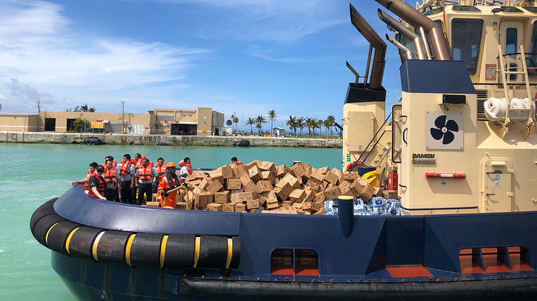 The cruise line launched an ambitious hurricane relief program to provide tens of thousands of meals daily to victims of Hurricane Dorian on Grand Bahama. The first ship, the Empress of the Seas, arrived Sept. 5 and anchored offshore of the still-closed harbor in Freeport. Workers aboard had spent all night cooking and packing 10,000 boxed lunches, which were ferried ashore by tenders and port tugs, along with bottled water and some canned provisions.