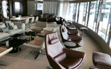 The observation lounge offers comfortable seating that looks out at the sea.