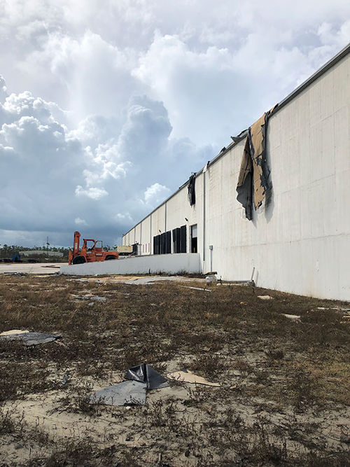 A warehouse near the port at Freeport lost part of its roof in Hurricane Dorian. A warehouse near the port at Freeport lost part of its roof in Hurricane Dorian.