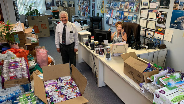 Doug Kostowski and Cuqui Ramos collected hurricane relief supplies at their agency. Doug Kostowski and Cuqui Ramos collected hurricane relief supplies at their agency.