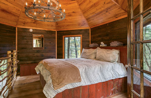The master bedroom at El Castillo, one of the resort’s newer treehouses. The master bedroom at El Castillo, one of the resort’s newer treehouses.