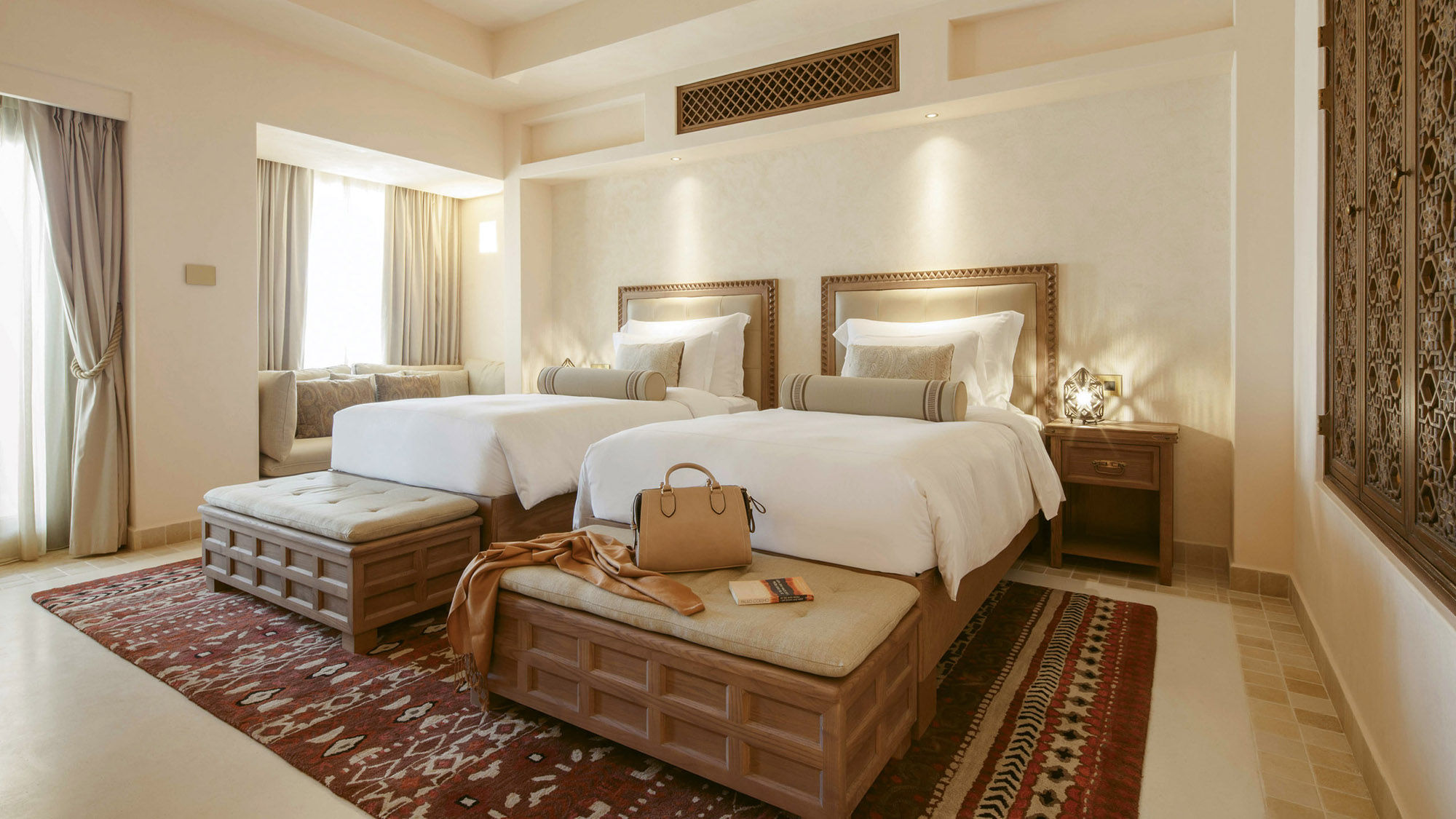 An Arabian Deluxe Twin Room at the Jumeirah Al Wathba Desert Resort & Spa.