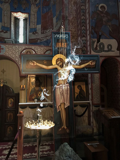 Smoke from devotional candles rises in the sunlight in Norashen Surb Astvatsatsin Church in Tblisi's old city. Smoke from devotional candles rises in the sunlight in Norashen Surb Astvatsatsin Church in Tblisi's old city.