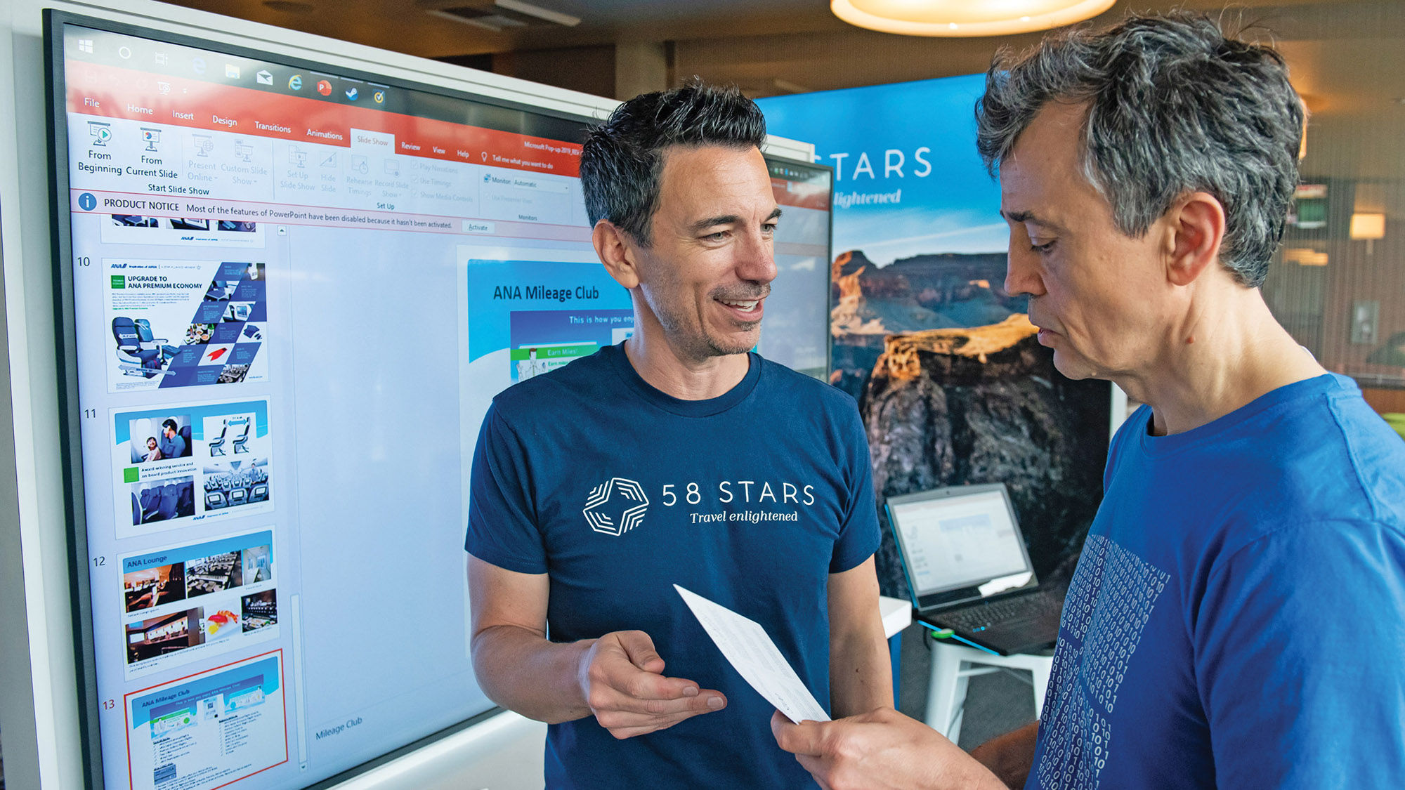 58 Stars co-owner Mike Salvadore talks with Microsoft employee Vladimir Sorokin on the Microsoft campus in Redmond, Wash.