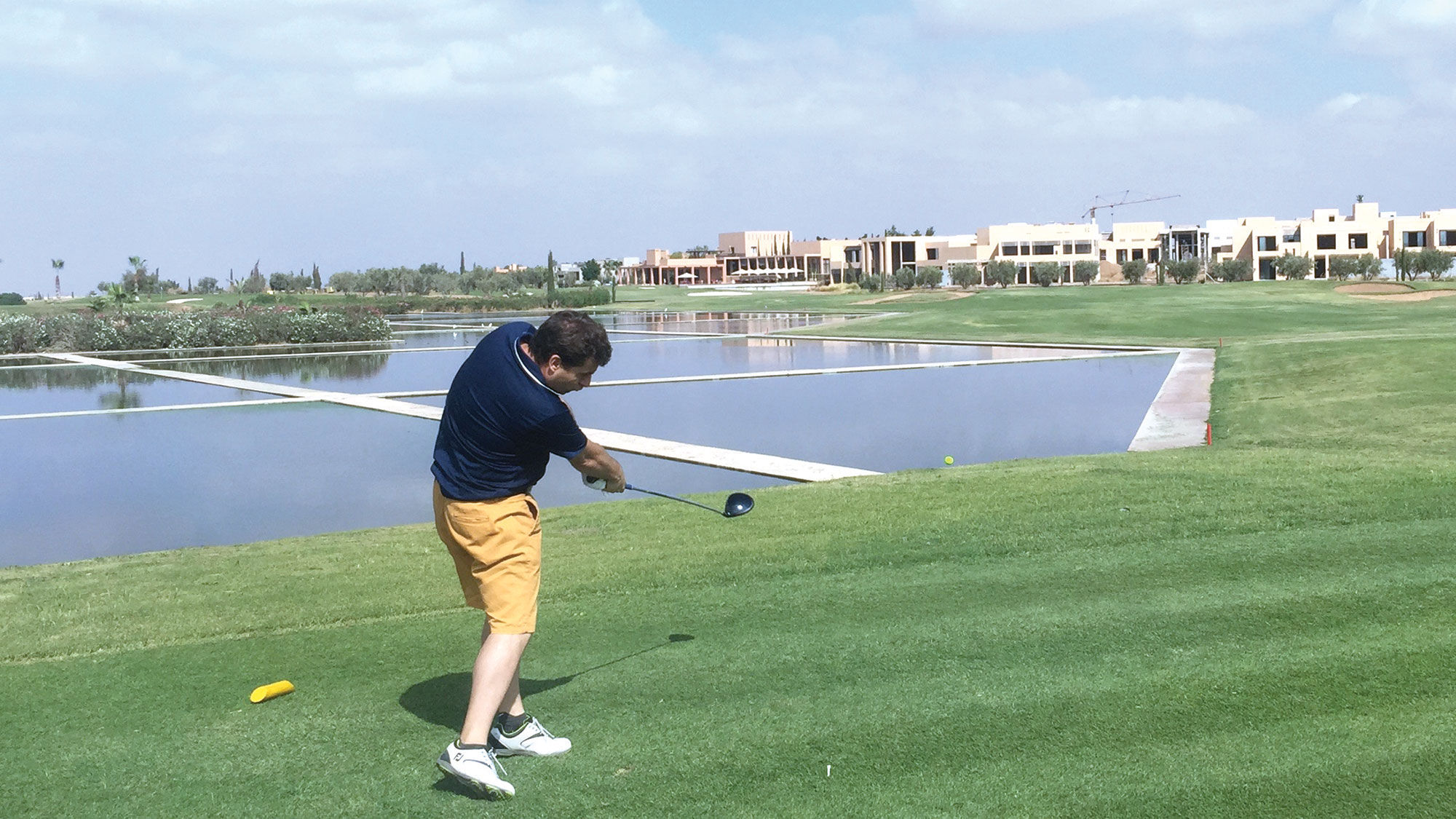 Water frames the left side of the 18th hole at the Al Maaden golf course outside of Marrakech, Morocco.