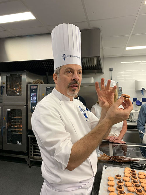 Le Cordon Bleu pastry chef Frederic Deshayes teaches Tauck guests how to make French macarons. Le Cordon Bleu pastry chef Frederic Deshayes teaches Tauck guests how to make French macarons.