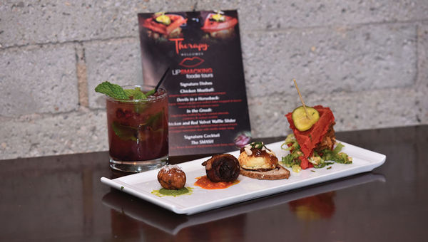 The restaurant Therapy is featured on the Downtown Lip Smacking Tour. The restaurant Therapy is featured on the Downtown Lip Smacking Tour.