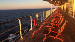 One of the chat questions asked participants to tweet about a "memorable" cruise ship. Chat host Rebecca Tobin tweeted that since almost all her cruises were memorable, she scrolled her photo library and landed on this shot of the Queen Mary 2's promenade deck at sunset.