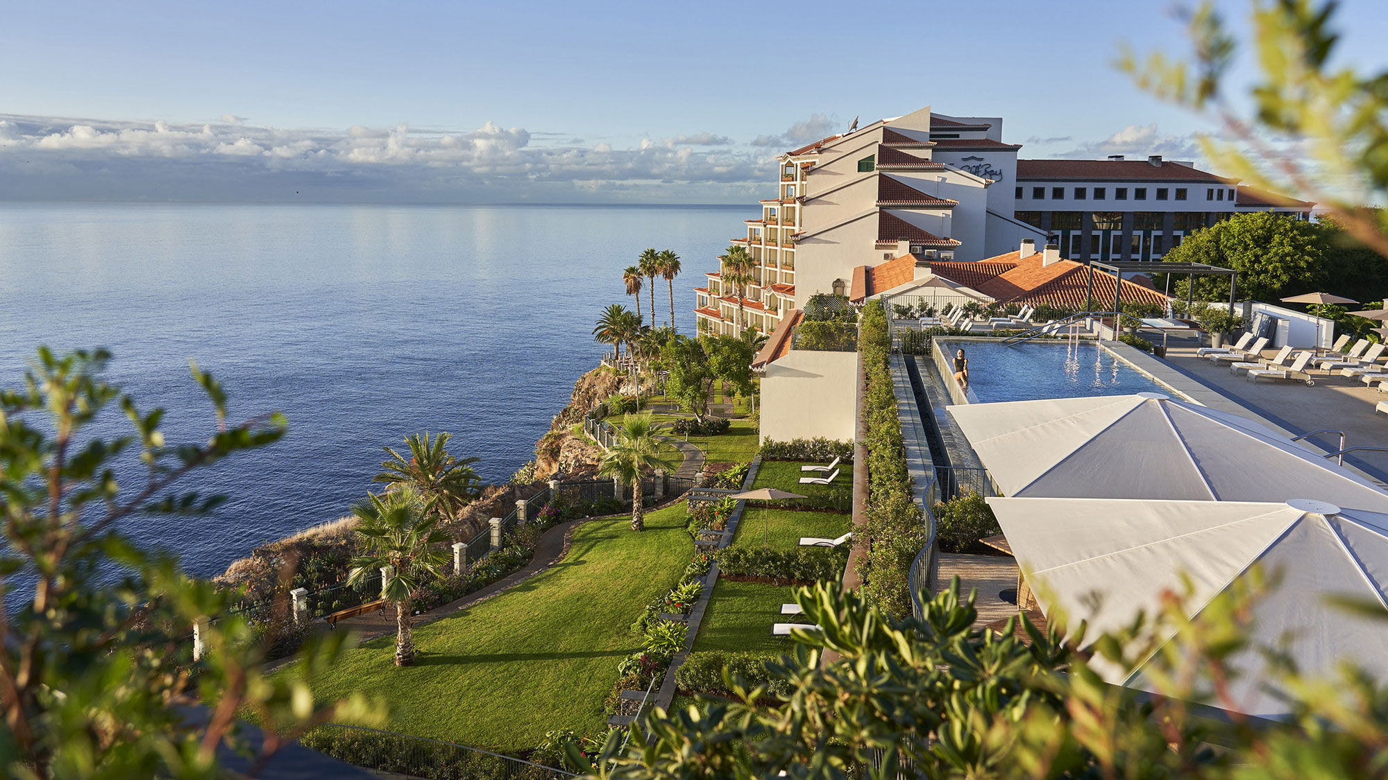 Les Suites at the Cliff Bay comprises two 100-year-old manors and a new wing connected by gardens, an infinity-edge pool and views of the Atlantic Ocean and Funchal Bay.