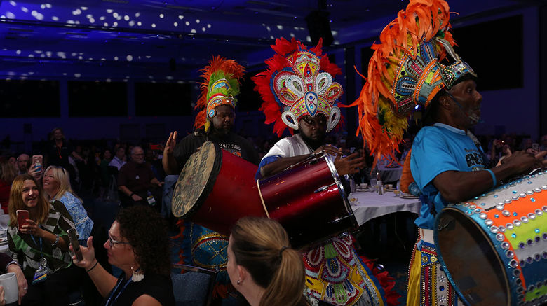 MSC Cruises surprises the CruiseWorld audience with a junkanoo band.