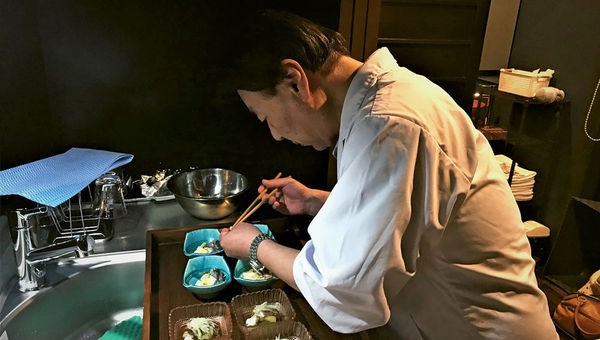 Shigene Sumitake, a 12th-generation chef, prepares dinner for guests at the Iori Takayama machiya.