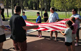 Guests participate in a flag-lowering ceremony at the Florence American Cemetery and Memorial, added to the itinerary by Celenza and Lombardis.