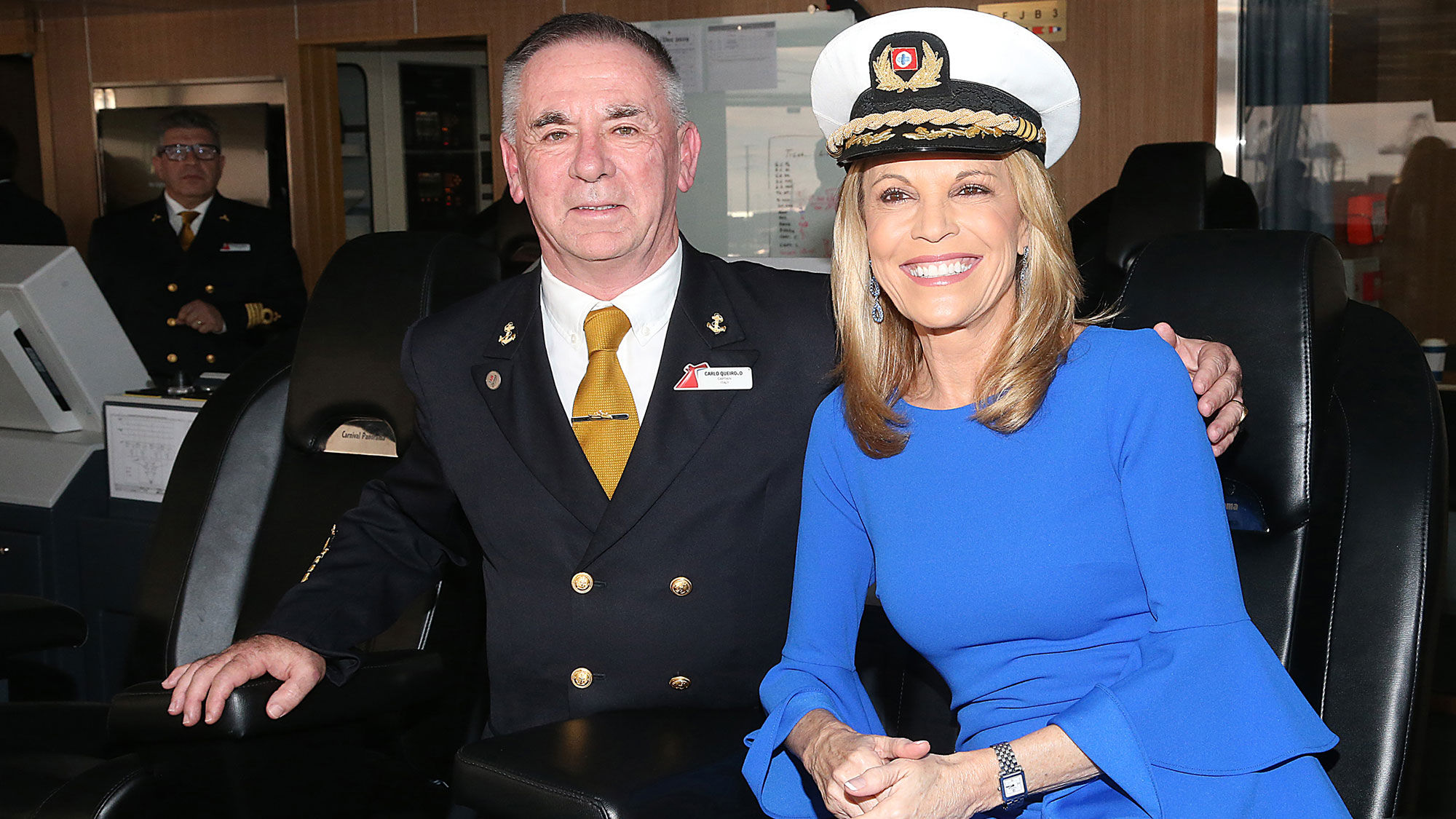 Carnival Panorama Capt. Carlo Queirolo with the ship's godmother, Vanna White.