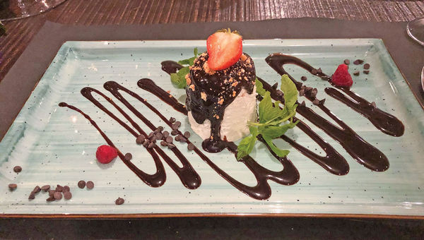 A dessert of vanilla gelato and hot chocolate sauce at Oficina Ormesini restaurant. A dessert of vanilla gelato and hot chocolate sauce at Oficina Ormesini restaurant.