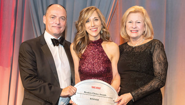 Northstar Travel Group’s Alicia Evanko, center, is flanked by Randall Soy and Kate Otto of Regent Seven Seas Cruises, which won the Cruise Ship: Luxury category for its Seven Seas Explorer.