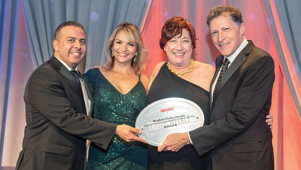 Erik De La Cruz, Ana Parodi and Michele Saegesser of Viking Cruises, which notched two wins, with Travel Weekly’s Arnie Weissmann.