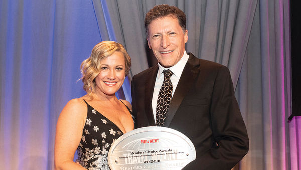 Robyn Basso of the Hawaii Visitors and Convention Bureau with Weissmann. Hawaii won the U.S. state category.