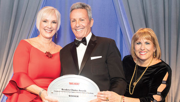 Cynthia Perry and Alexis Romer of Marriott International,  which won in the Domestic category for the 16th year in a row, flank Travel Weekly’s Bruce Shulman.