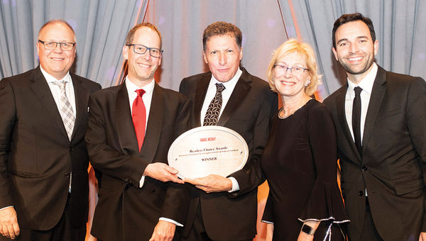Travel Weekly’s Arnie Weissmann, center, is flanked by Jonathan Hope, Doug Johnson, Inna Germanotta and Josh Mahon of Rocky Mountaineer, which notched its 11th consecutive win in the Rail Vacation category. Travel Weekly’s Arnie Weissmann, center, is flanked by Jonathan Hope, Doug Johnson, Inna Germanotta and Josh Mahon of Rocky Mountaineer, which notched its 11th consecutive win in the Rail Vacation category.