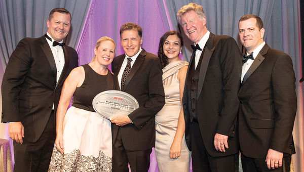 Travel Weekly’s Arnie Weissmann, holding award, is flanked by Christian Leibl-Cote, Jaclyn Leibl-Cote, Courtney Iannuccilli, Dan Sullivan Jr. and Jeff Roy of Collette, which won in the Canada category.