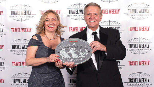 Chanda Vudmaska and Jack Richards of Pleasant Holidays, winner in the Hawaii category for the 15th time.