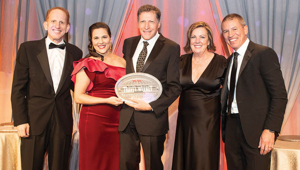Travel Weekly’s Arnie Weissmann, center, is flanked by, from left, Harry Sommer, Katina Athanasiou, Camille Olivere and Andy Stuart of Norwegian Cruise Line, which won for Hawaii/Pacific,  Private Island/Destination and agent loyalty program.