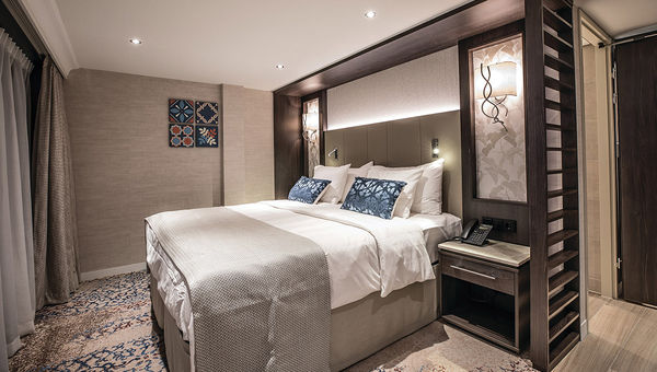 An Andorinha suite, showing azulejo-inspired wall art and grapevine-inspired wall lamps. An Andorinha suite, showing azulejo-inspired wall art and grapevine-inspired wall lamps.