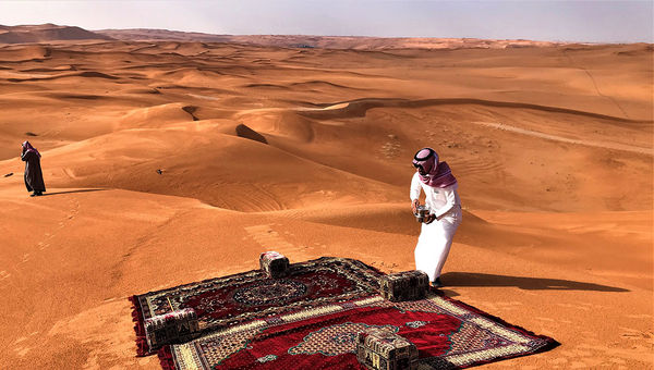 Tariq al Salamah, comanaging director of the tour operator Al Boraq, prepares to serve tea and dates to journalists and social media influencers on the excursion into the desert. Tariq al Salamah, comanaging director of the tour operator Al Boraq, prepares to serve tea and dates to journalists and social media influencers on the excursion into the desert.