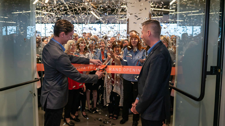 Michael (left) and Jeff Anderson cut the ribbon to commemorate the opening of Avoya's new Innovation Center in January 2020.