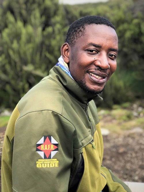 Lead guide Eliakim Mshanga, trained to assess high altitude-related illnesses, suspected the underlying cause of Dash’s symptoms was a stomach bug. Lead guide Eliakim Mshanga, trained to assess high altitude-related illnesses, suspected the underlying cause of Dash’s symptoms was a stomach bug.