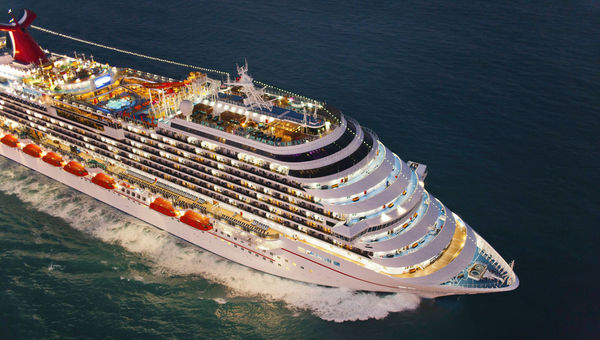 Before: The Carnival Magic, pre-drydock, with the line's standard, white hull with red stripe. Before: The Carnival Magic, pre-drydock, with the line's standard, white hull with red stripe.