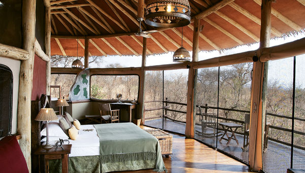 A room atop a tree at the Tarangire Treetops camp, with a deck from which to watch animals from the comfort of rocking chairs.
