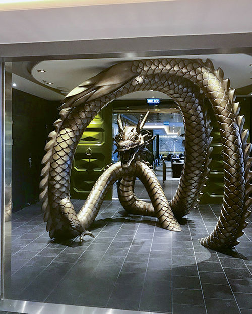 Pacific Rim, a Pan-Asian restaurant, features a large dragon sculpture at the entrance.