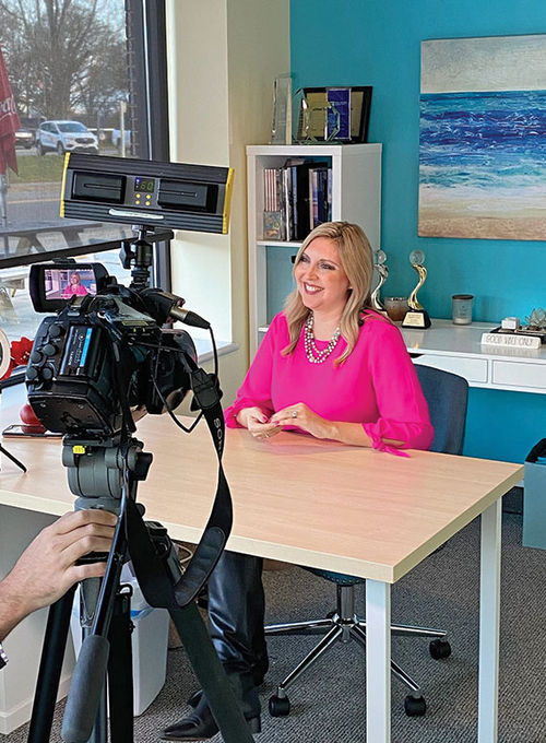 Vanessa McGovern, co-founder and CEO of the Gifted Travel Network in Mooresville, N.C., being interviewed in GTN’s offices for an appearance on WCNC, Charlotte's NBC affiliate..