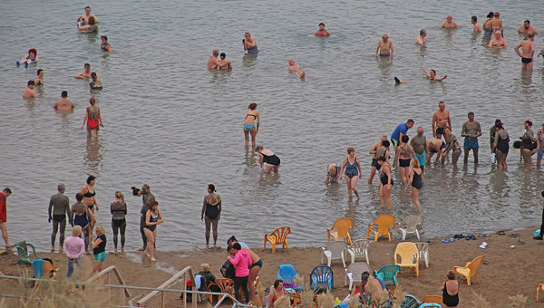 Dead Sea visitors wade into the hypersaline waters and slather on mud. Dead Sea visitors wade into the hypersaline waters and slather on mud.